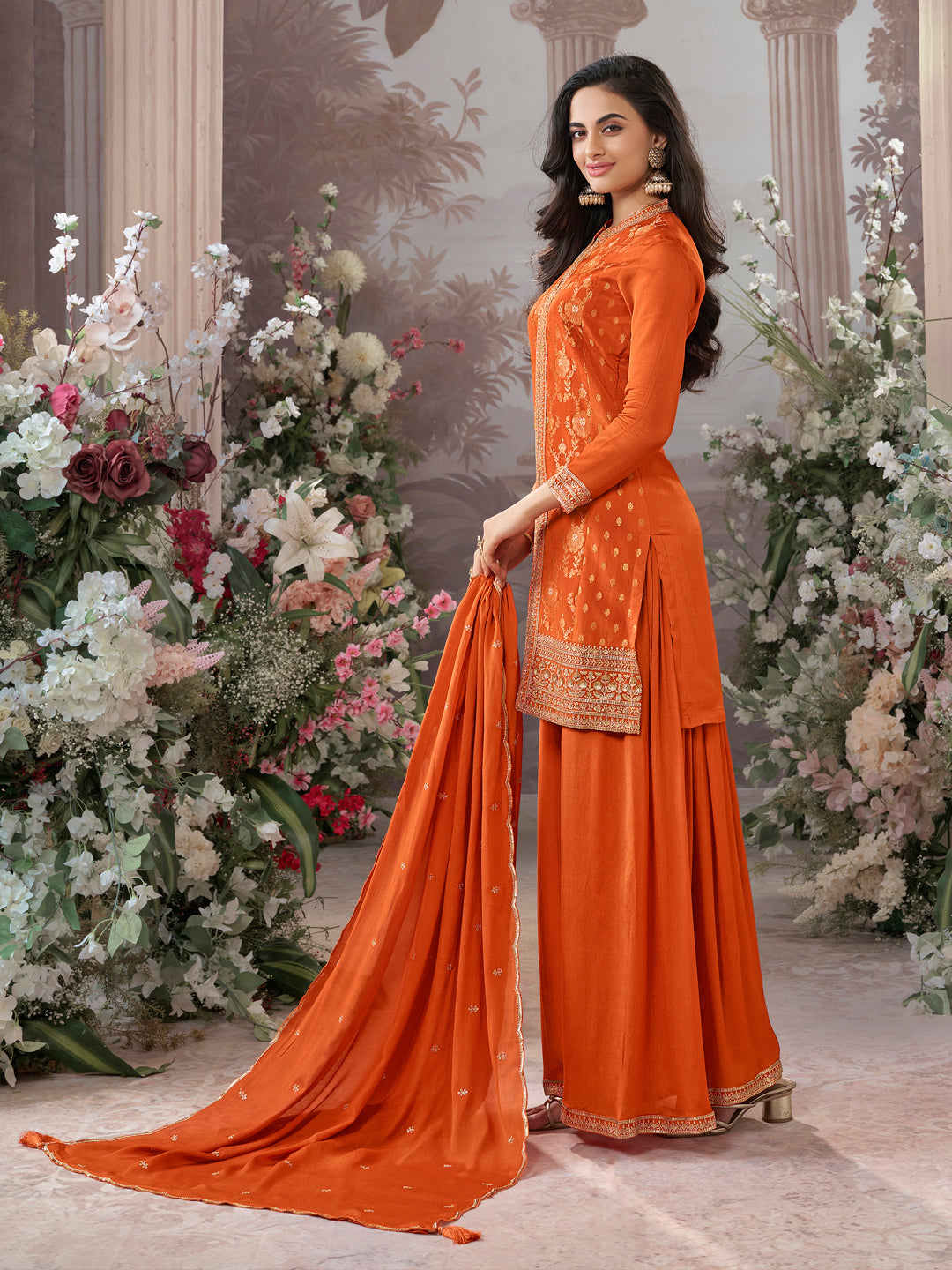 Orange Chinon Kurta Set with Heavy Jacquard Work Paired with Chinon Dupatta with Embroidered Work.