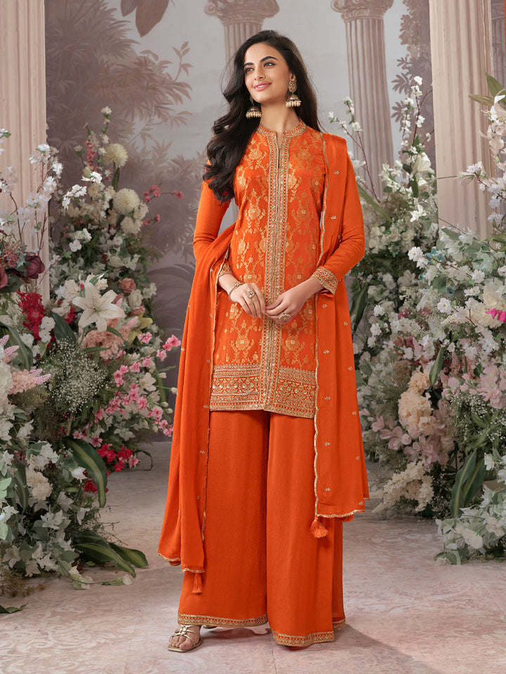 Orange Chinon Kurta Set with Heavy Jacquard Work Paired with Chinon Dupatta with Embroidered Work.