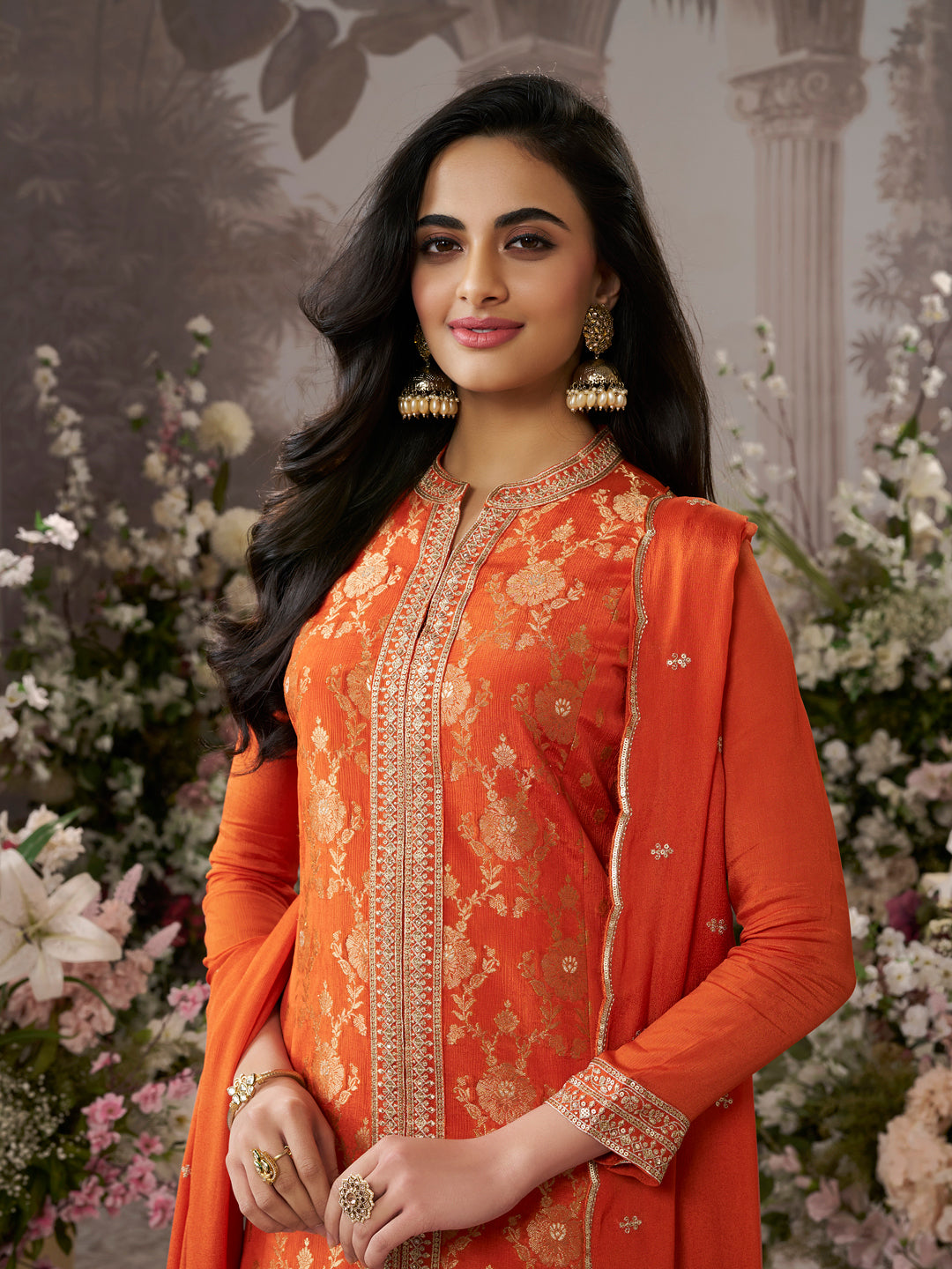 Orange Chinon Kurta Set with Heavy Jacquard Work Paired with Chinon Dupatta with Embroidered Work.